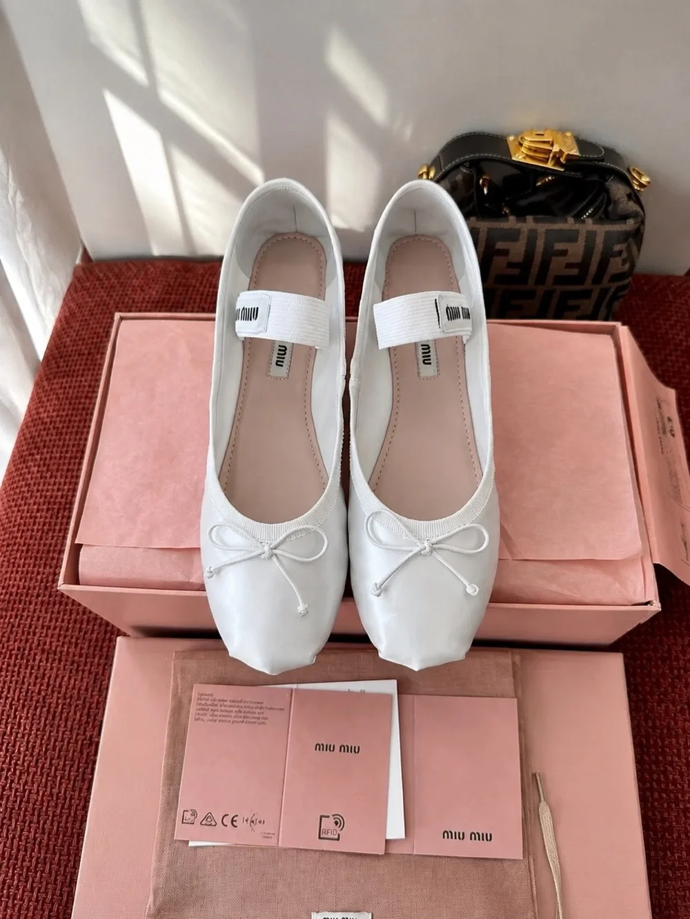 Miu Miu White Leather Ballet Flats with Bow and Elastic Strap
